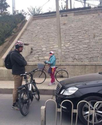 laowai cyclist traffic enforcer bicycle beijing block car