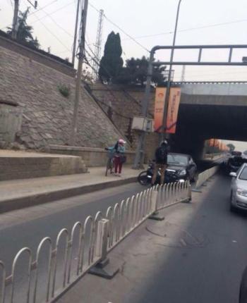 laowai cyclist traffic enforcer bicycle beijing block car