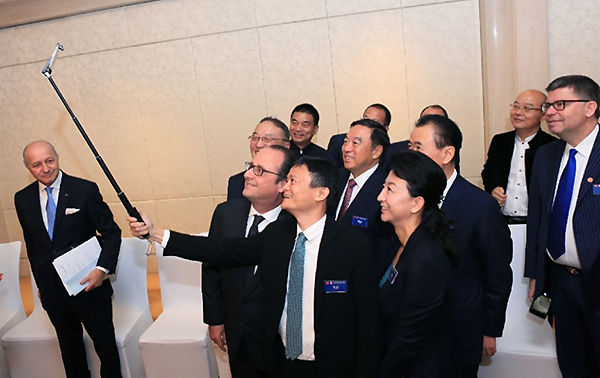 french president hollande chinese tycoon selfie